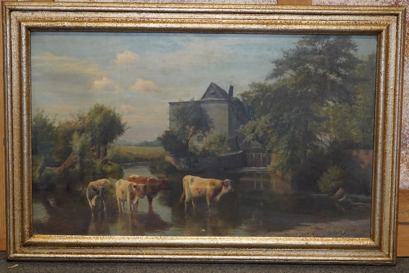 William Sidney Cooper (English, 1854-1927), Cattle watering before a water mill, oil on canvas, 45 x 75cm